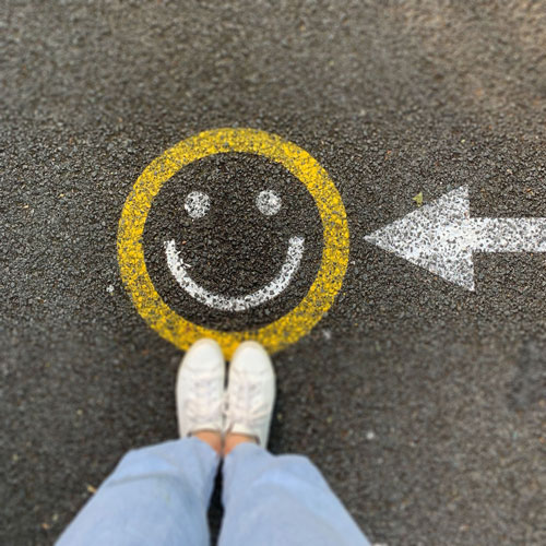 happy face painted on blacktop